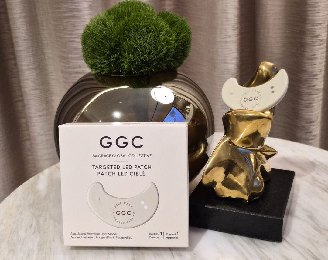 GGC packaging and LED patch beside a gold sculpture and greenery